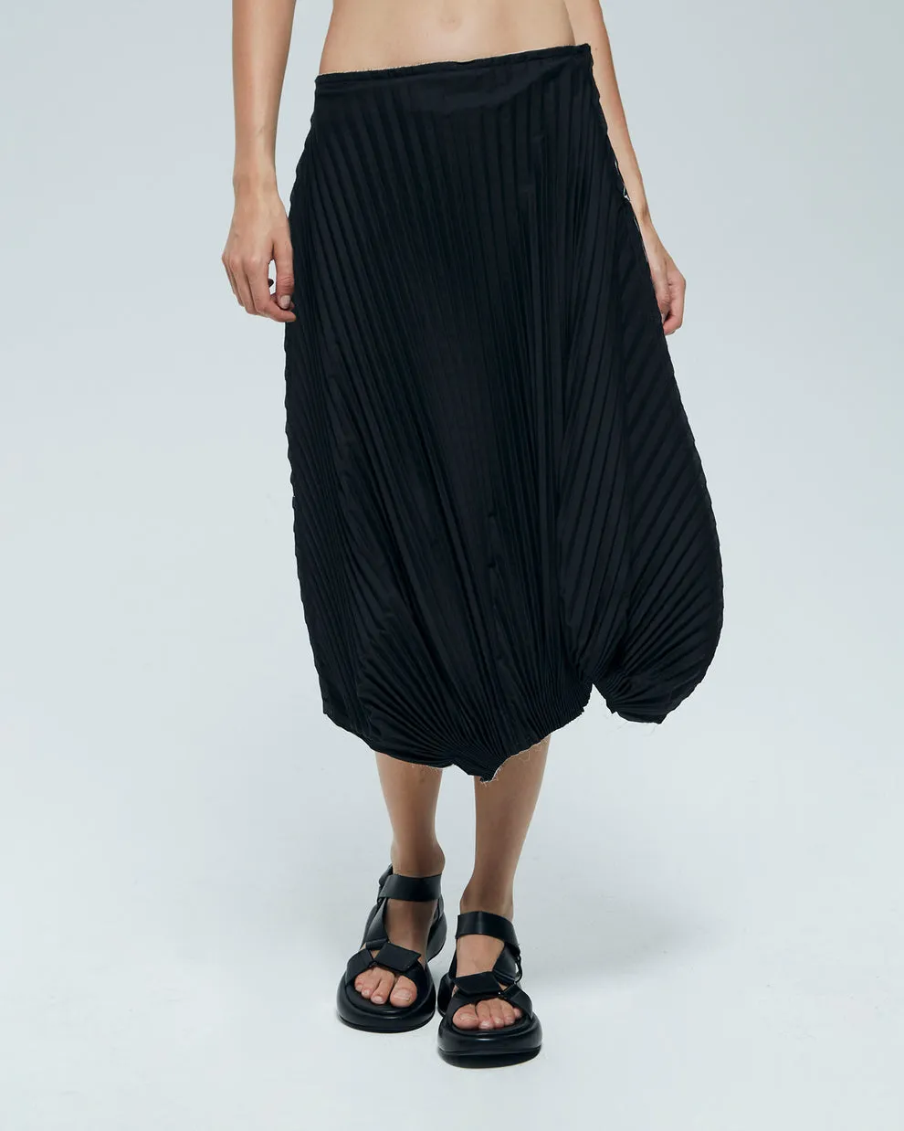 Asymmetric pleated skirt