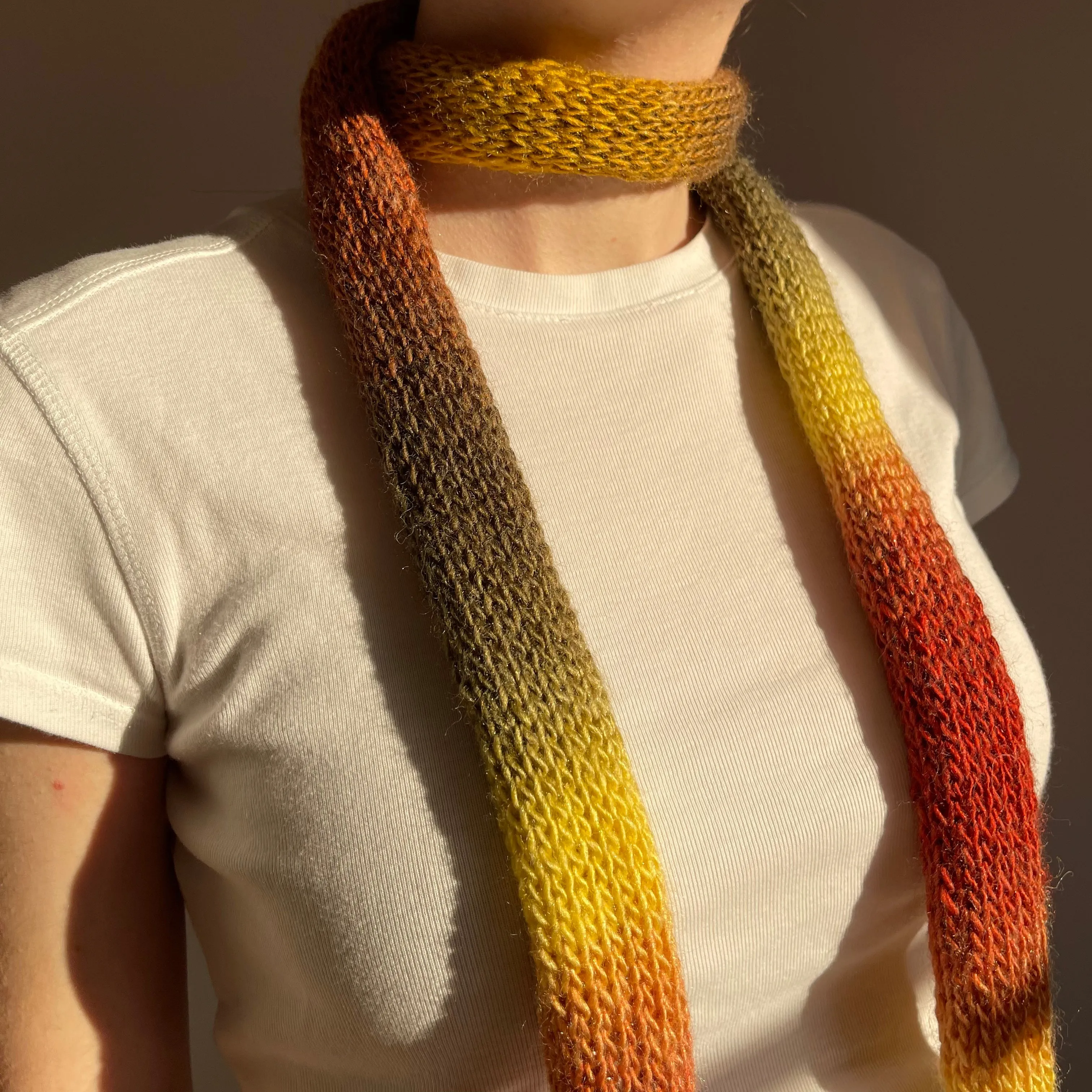 Handmade knitted ombré skinny scarf in earth tones